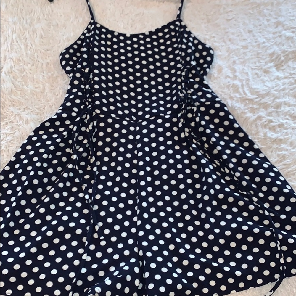 Dark blue romper with white polka dots
